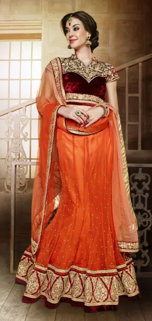 Orange wedding lehenga with heavy worked maroon choli